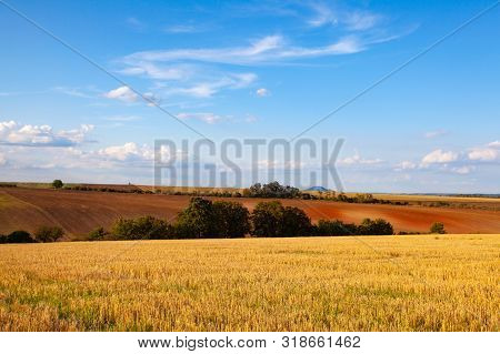 The Famous Mountain Rip On Horizon.  The Field After Harvesting In Sunny Day. Picture With Mowed Whe