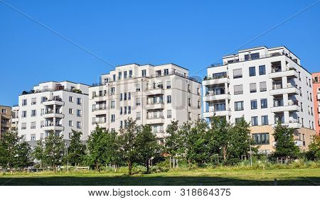 Modern Apartment Houses With A Green Park Seen In Berlin, Germany