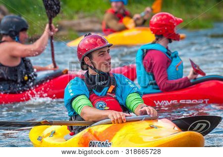 Myhiya, Ukraine - August 17, 2019: Playboating. A Company Of Young Freestyle Kayakers. A Short Break