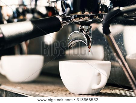 Espresso Machine Brewing A Coffee. Coffee Pouring Into Glasses In Coffee Shop, Espresso Pouring From