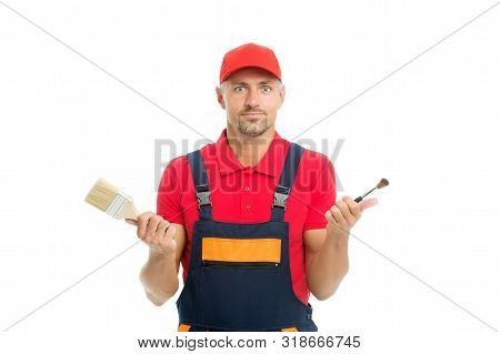 Which One. Decorator Creative Work. Paint And Renovate. Decorator Painting Wall. Man Hold Brushes Wh