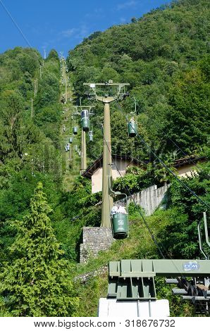 Laveno, Lake Maggiore, Italy. 16th August 2019. The Famous Open Cablecar Up The Mountain Of Sasso De