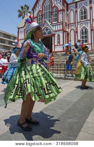 ARICA, CHILE - FEBRUARY 11, 2017: Members of a Waca Waca dance group in ornate costume performing at