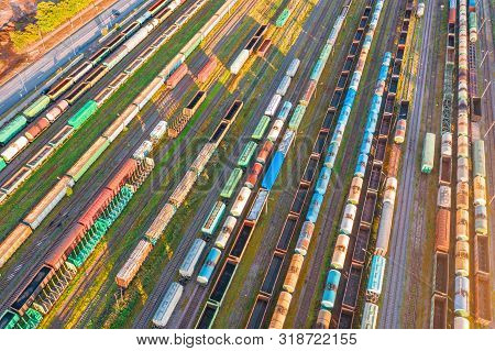 Rail Sorting Freight Station With Various Railway Cars, With Many Rail Tracks Railroad. Aerial View 