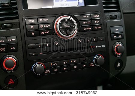 Novosibirsk, Russia - August 01, 2019:  Nissan Pathfinder, Modern Black Car Interior: Radio, Tv, Dvd