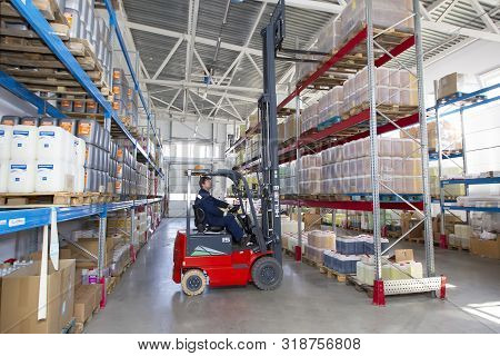 Belarus, The City Of Mensk, April 12, 2019. Chemical Production.worker On A Loader In A Warehouse