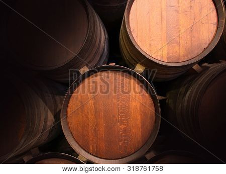 Row Of Wooden Barrels Of Tawny Portwine ( Port Wine ) In Cellar, Porto, Portugal. Vintage Old Style