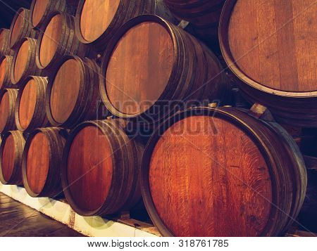Row Of Wooden Barrels Of Tawny Portwine ( Port Wine ) In Cellar, Porto, Portugal. Vintage Old Style