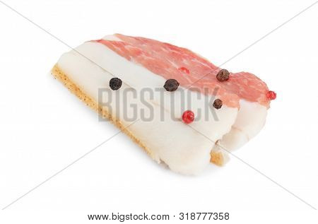 Slices Of Pork Fatback With Pepper Isolated On White