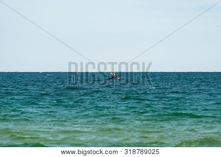Sunny Beach, Bulgaria July 13, 2019. The Man Practices Hydrofoil Kitesurfing In The Black Sea Off Th