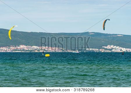 Sunny Beach, Bulgaria July 13, 2019. The Man Practices Hydrofoil Kitesurfing In The Black Sea Off Th