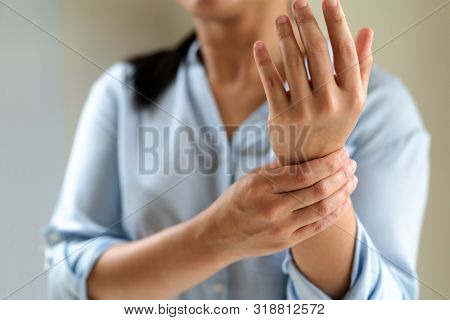 Woman Wrist Arm Pain Long Working. Office Syndrome Healthcare And Medicine Concept