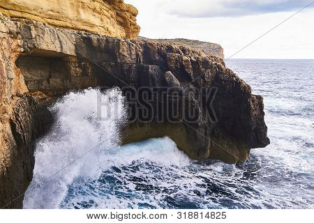 Huge Waves Crash On Cloudy Day. Kemmuna Island