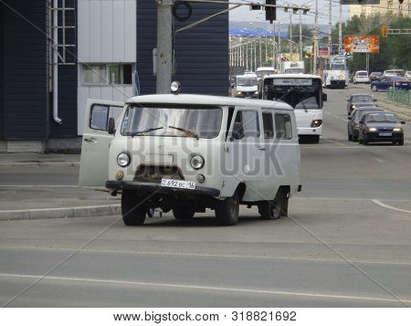 Kazakhstan, Ust-kamenogorsk, August 9, 2019: Car With Broken Wheel (tire). Uaz 452. Traffic. One Of 