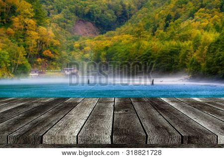 Empty Grey Wooden Table Or Wooden Terrace With Beautiful View Of Taisho Pond At Kamikochi National P