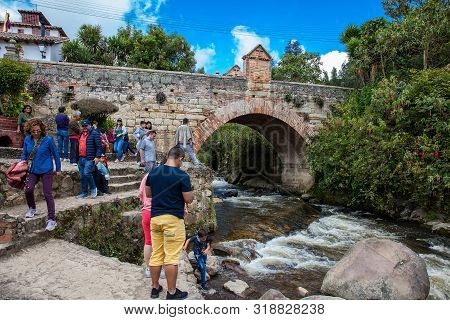 Mongui, Colombia - August, 2019: Tourists Visiting The Royal Bridge Of Calicanto At The Beautiful Sm