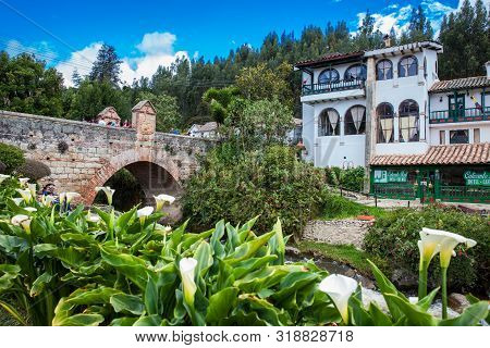 Mongui, Colombia - August, 2019: Tourists Visiting The Royal Bridge Of Calicanto At The Beautiful Sm