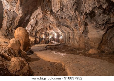 Pathway Underground Cave In Laos, With Stalagmites And Stalactites