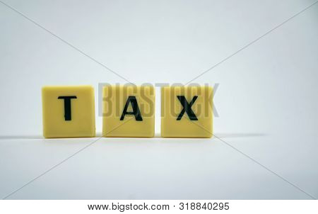 Tax Word Concept Light Background Image Using By Block Letter For Various Purposes Of Tax Return Or 