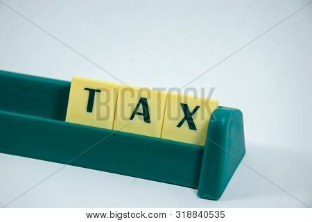 Tax Word Concept Light Background Image Using By Block Letter For Various Purposes Of Tax Return Or 