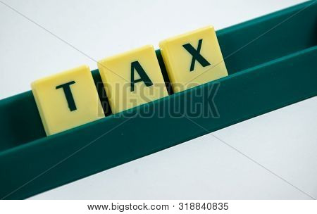 Tax Word Concept Light Background Image Using By Block Letter For Various Purposes Of Tax Return Or 