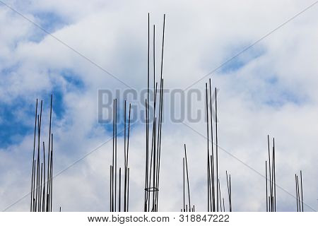 Bright Blue Sky With Some Of Rods In A Construction Site.