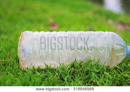 Plastic Pollution - Plastic Bottle Is Fallen Down In The Grass