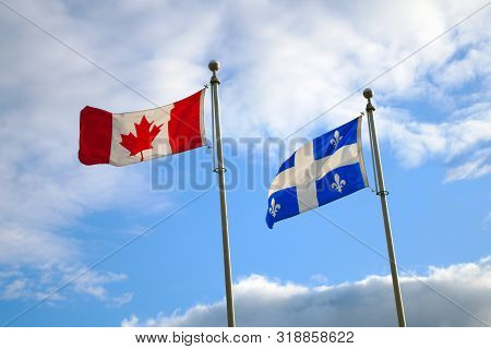 Quebec Canada Flags Waving In Blue Sky National French America