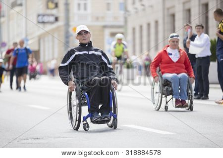 Belarus, The City Of Gimel, July 03, 2019. Youth Festival.wheelchair Race.a Man And A Woman In A Whe