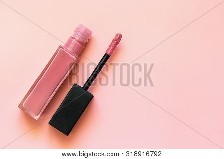 Lipstick And Applicator Wand On Pastel Pink Backgrpund. Liquid Lip Stick Open Tube. Makeup Cosmetic 