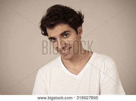Portrait Of Young Handsome Cheerful Man With Smiling Happy Face. Human Expressions And Emotions