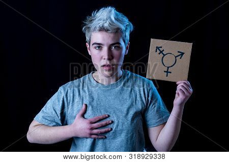 Portrait Of Happy Proud And Confident Trans Teenager Man Holding Transgender Symbol