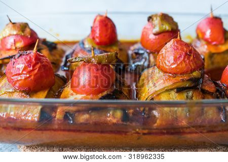 Turkish Islim Kofta Kebab With Meatballs And Cherry Tomatoes Wrapped In Eggplant / Aubergine Slices.