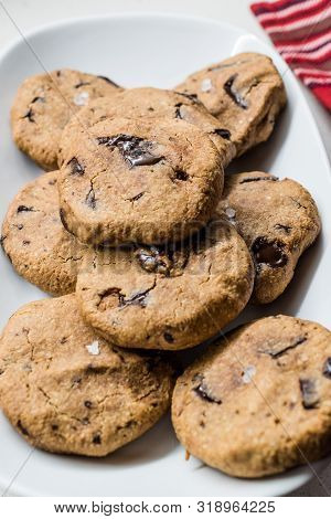 Paleo Chocolate Chip Cookies Made With Coconut And Almond Flour On Baking Sheet / Paper.