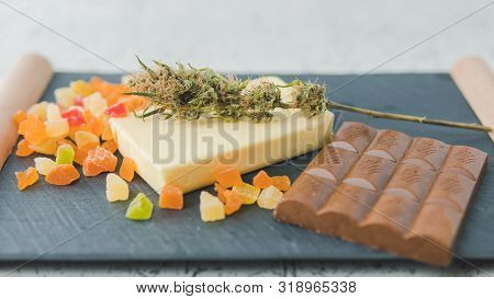 Preparing To Cooking Cake With Cannabis Butter. Concept Of Using Marijuana In Food Industry.