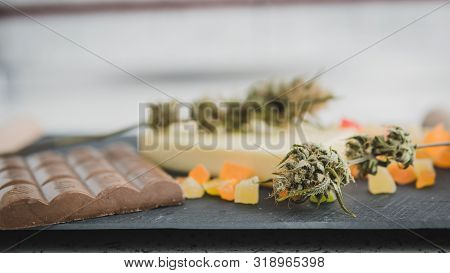Preparing To Cooking Cake With Cannabis Butter. Concept Of Using Marijuana In Food Industry.