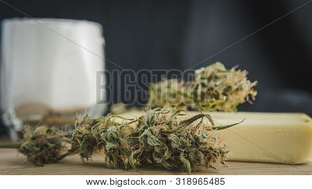 Preparing To Cooking Cake With Cannabis Butter. Concept Of Using Marijuana In Food Industry.