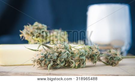 Preparing To Cooking Cake With Cannabis Butter. Concept Of Using Marijuana In Food Industry.