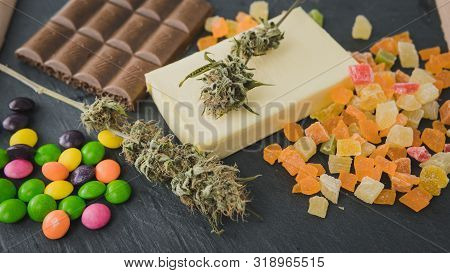 Preparing To Cooking Cake With Cannabis Butter. Concept Of Using Marijuana In Food Industry.