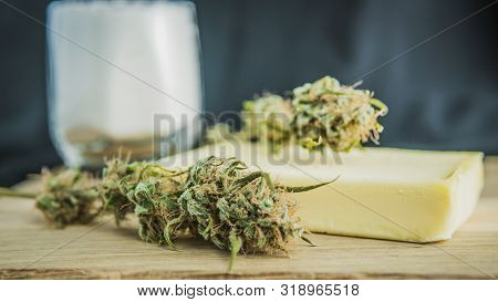 Preparing To Cooking Cake With Cannabis Butter. Concept Of Using Marijuana In Food Industry.