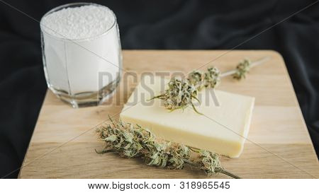 Preparing To Cooking Cake With Cannabis Butter. Concept Of Using Marijuana In Food Industry.