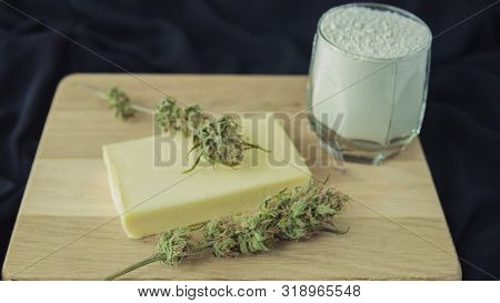 Preparing To Cooking Cake With Cannabis Butter. Concept Of Using Marijuana In Food Industry.