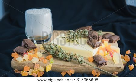 Preparing To Cooking Cake With Cannabis Butter. Concept Of Using Marijuana In Food Industry.