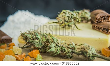 Preparing To Cooking Cake With Cannabis Butter. Concept Of Using Marijuana In Food Industry.