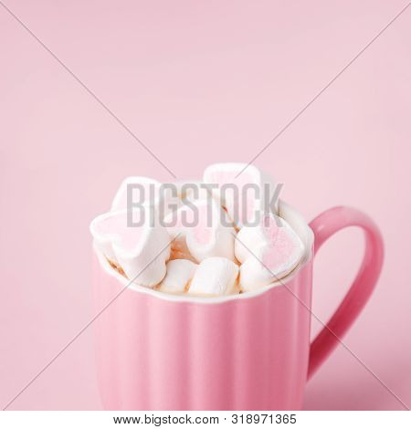 Pink Light Pastel Background. Cup Of Dark Coffee, Hearts Shaped Marshmallow. Valentine's Wedding Day