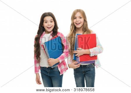 Pads Perfect For The Academic Use. Cute Small School Children Holding Note Pads. Adorable Little Gir