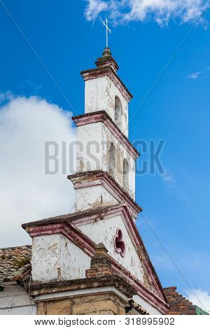 Bell Tower Of The Historical Chapel Of San Antonio De Padua Built On 1557 At The Beautiful Small Tow
