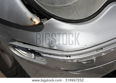 Generic Car With Unrepaired Accident Damage - Rust Overcoming Bent Steel.