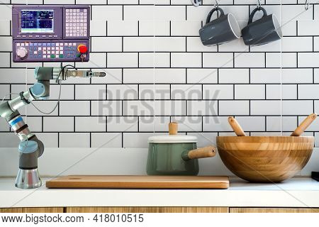 Modern Home Installed Robot Arm Gripping And Control Panel For Assist Resident To Work On Kitchen Ro