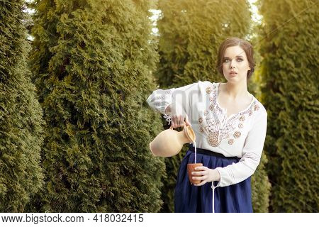 Working Housewife In Village Dress Picking Colorful Kidney Beans On Table For Storing In Countryside